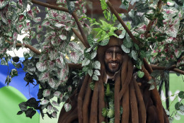 A performer is outfitted as a tree during a welcoming ceremony for Athletes at the 2016 Summer Olympics in Rio de Janeiro, Brazil, Wednesday, Aug. 3, 2016. (AP Photo/Robert F. Bukaty)