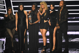 Ally Brooke, from left, Lauren Jauregui, Normani Hamilton, Dinah Jane Hansen, and Camila Cabello of Fifth Harmony and Ty Dolla $ign accept the award for best collaboration video for Work From Home at the MTV Video Music Awards at Madison Square Garden on Sunday, Aug. 28, 2016, in New York. (Photo by Charles Sykes/Invision/AP)