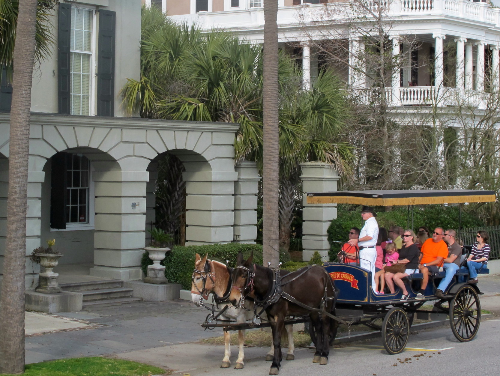 In this Dec. 28, 2014 photo, a carriage pauses in the historic district in in Charleston, S.C. Low gas prices, a thriving economy and renewed consumer confidence are expected to mean a banner season in 2015 for South Carolina's tourism industry. (AP Photo/Bruce Smith)