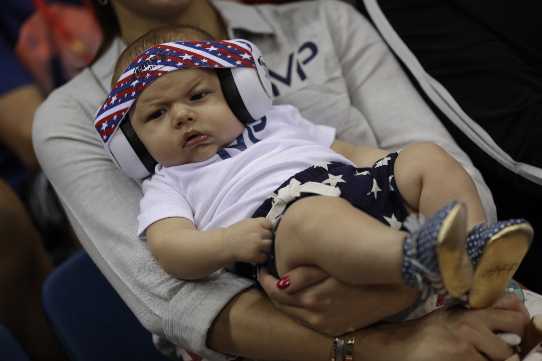 United States' Michael Phelps' son Boomer wears ear protection during the swimming competitions at the 2016 Summer Olympics, Monday, Aug. 8, 2016, in Rio de Janeiro, Brazil. (AP Photo/Michael Sohn)