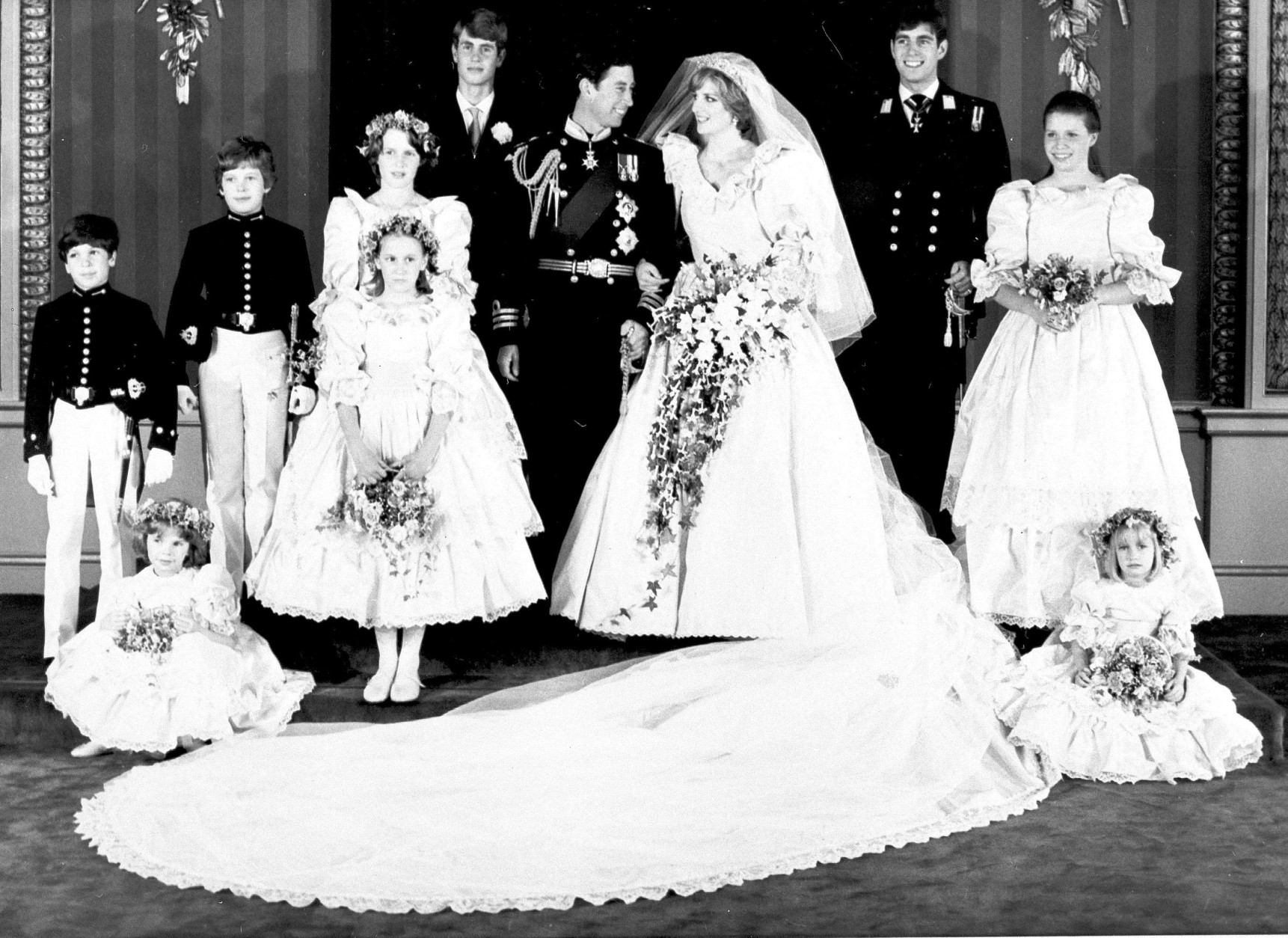 Prince Charles and his bride Diana, Princess of Wales, pose in the Throne Room of Buckingham Palace for this picture made after their wedding at St. Paul's Cathedral today.  Back row, left to right: Edward van Cutsem, Lord Nicholas Windsor, Sarah Jane Gaselee, Prince Edward, Prince Charles, The Princess of Wales, Prince Andrew and Lady Sarah Armstrong-Jones. Front row, left to right: Catherine Cameron, seated, India Hicks, standing, and Clementine Hambro, seated.  (AP Photo, BIPNA, Pool)