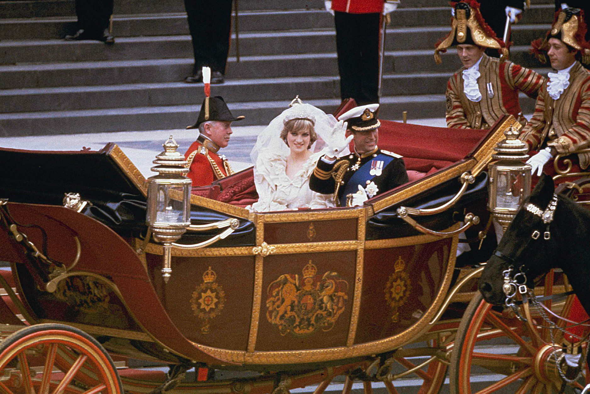 The carriage carrying the Prince and Princess of Wales passes along Trafalgar Square on its way from St. Paul's Cathedral to Buckingham Palace after the royal wedding in London on July 29, 1981.  (AP Photo)