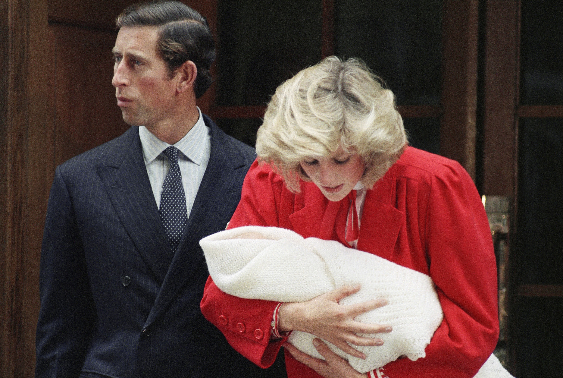 FILE -- The Prince and Princess of Wales, Prince Charles and Princess Diana leave St. Mary's Hospital in Paddington, London with their new baby son on Sept. 16, 1984.    Princess Diana carries new baby,  Prince Harry who was born on Sept. 15.    (AP Photo)