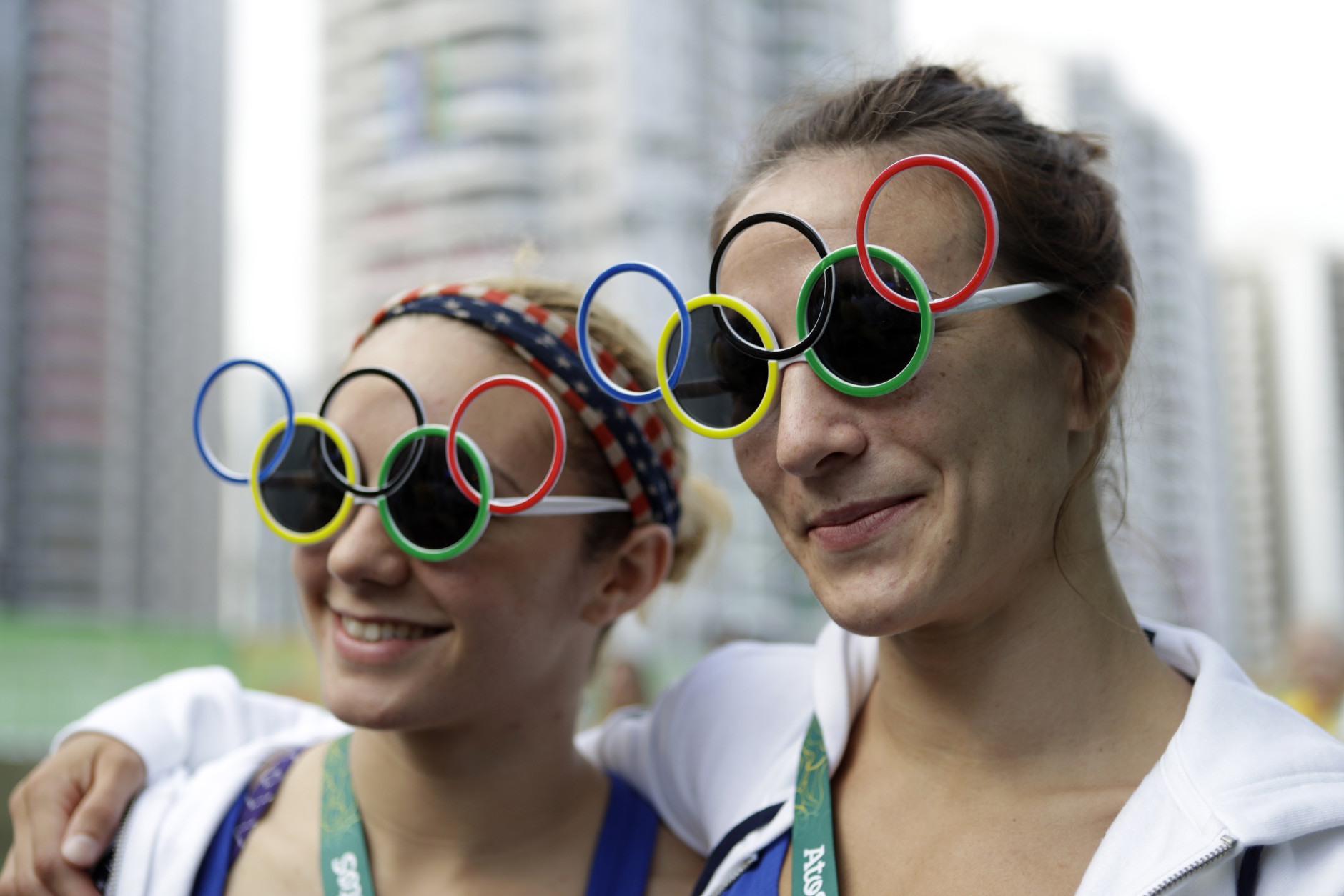 Judo competitors Angelica Delgado, of Miami, left, and Marti Malloy, of Oak Harbor, Wash., watch a welcoming ceremony at the 2016 Summer Olympics in Rio de Janeiro, Brazil, Wednesday, Aug. 3, 2016. (AP Photo/Robert F. Bukaty)
