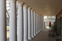 A student walks along the lawn at the University of Virginia in Charlottesville, Va., Monday, Nov. 24, 2014. The school ranked, No. 24 on the 2016 Best Colleges report from U.S. News and World Report.(AP Photo/Steve Helber)