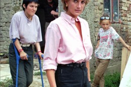 Britain's Diana Princess of Wales, center, folowed by Mirzeta Gabelic, left, a 15 year-old land mine victim, leaves her home in Sarajevo, Sunday August 10, 1997. Diana is on three-day visit to Bosnia-Herzegovina, to focus world attention on the continuing plaque of land mines and to call for a complete ban on the production, sale and use of land mines.(AP PHOTO/Hidajet Delic)