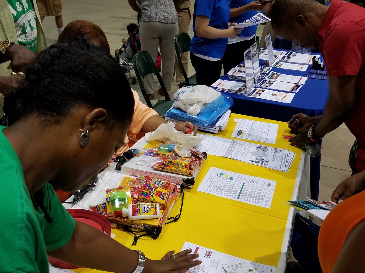 Volunteers hand out supplies at the Prince George's County Back to School Fair on Saturday, Aug. 6, 2016. (WTOP/Allison Keyes)