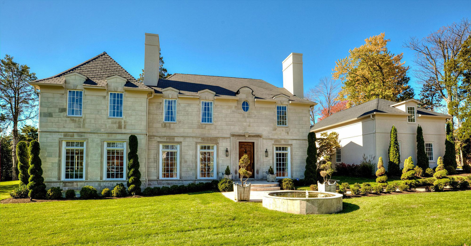 This photo provided by MRIS listing service shows 610 Braddock Road in Alexandria, Virginia. The French country-style house was built in 2012 and features seven bedrooms and nine bathrooms. The home sold for $3.765 million in July. (MRIS)