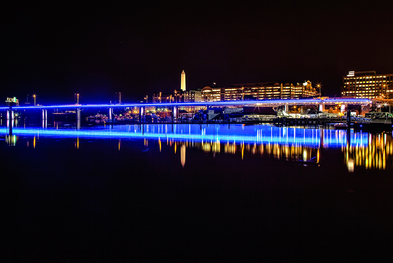 More than 400 energy-efficient LED lights were installed on the Case Bridge, highlighting its piers and stonework, with the blue light reflected in the water. (Courtesy Hoffman-Madison/Matthew Borkowski)