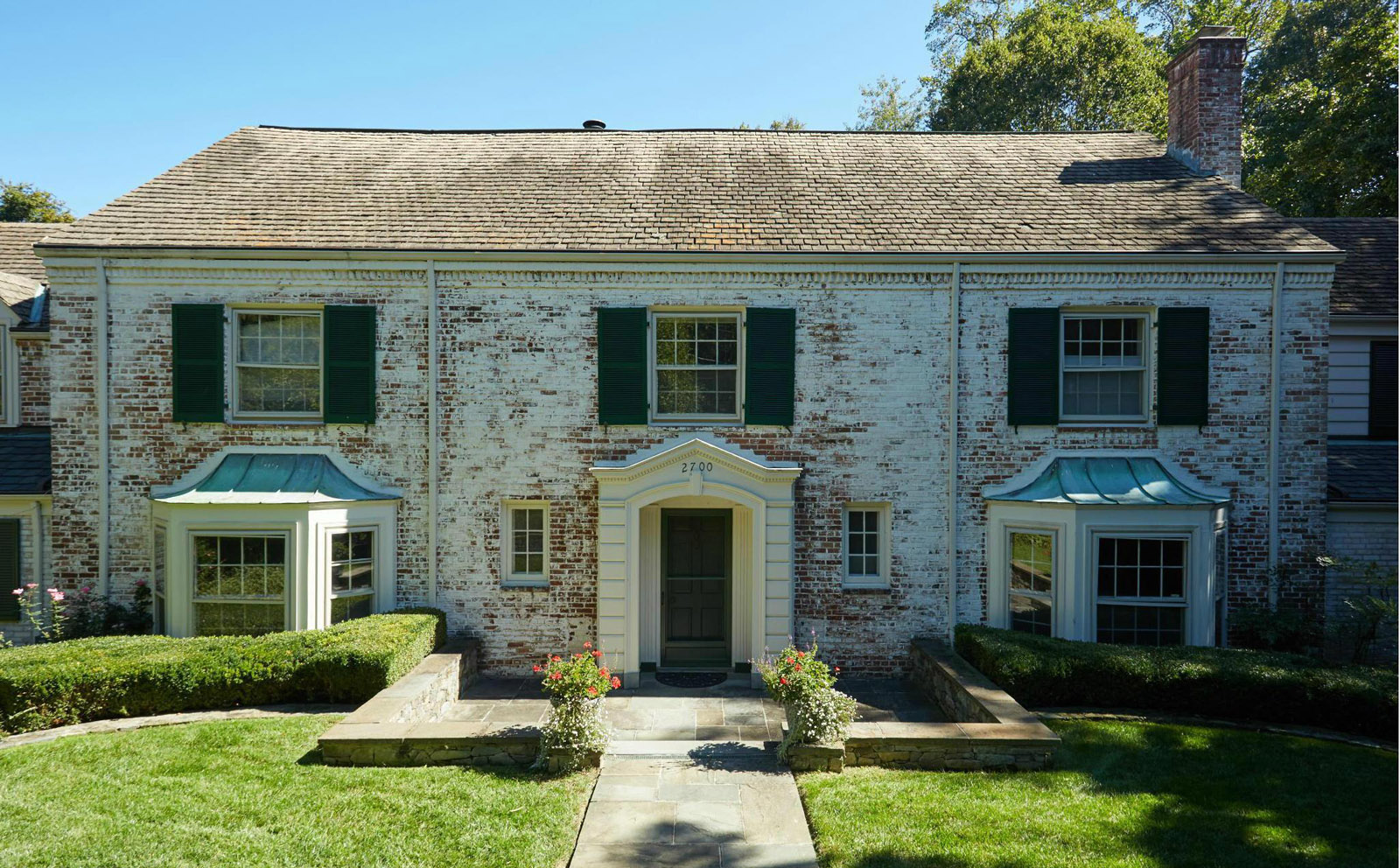 This photo provided by MRIS listing service shows 2700 Chesapeake Street NW in Washington, D.C. The colonial-style home was built in 1951 and features seven bedrooms and six  bathrooms. It sold for $2.85 million in July. (MRIS)
