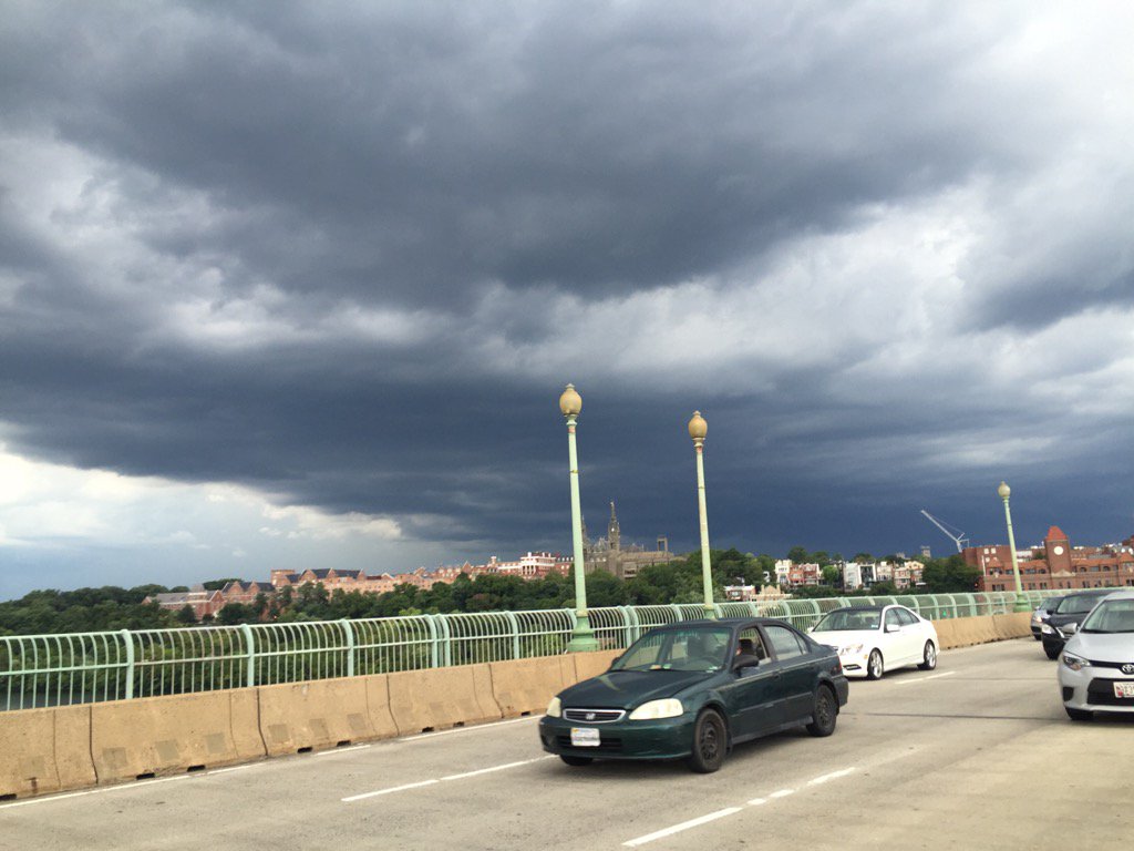 D.C. traffic: Dark clouds and lightning over Georgetown; a pretty ominous scene. (WTOP/Rob Woodfork)