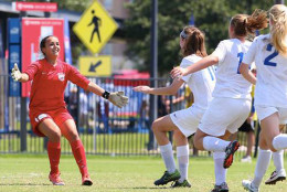 BRYC 01 Elite players charge toward their goalie, Riley Melendez, after beating The USA Stars of California. The national semifinal game was won with penalty kicks. 