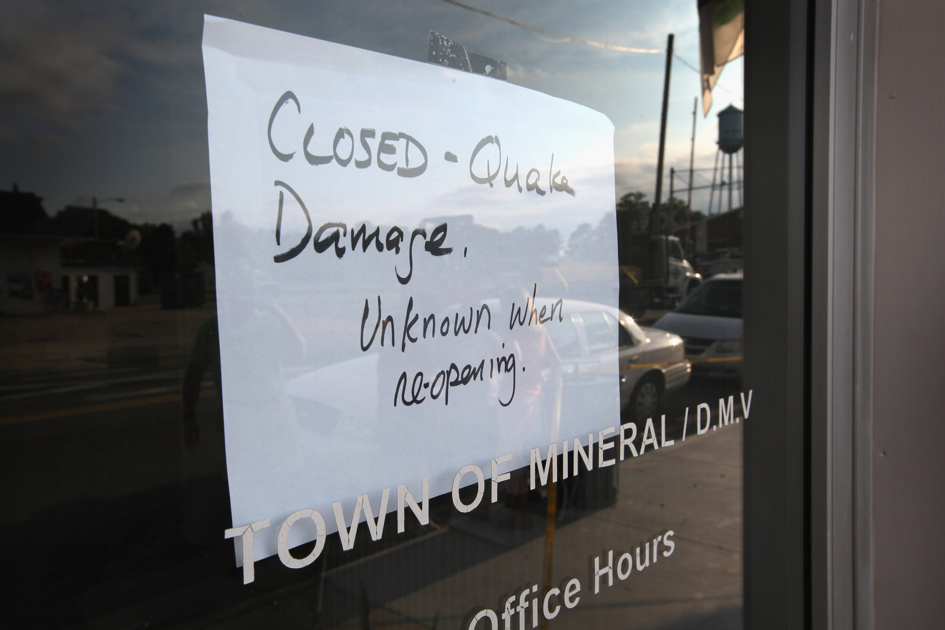 MINERAL, VA - AUGUST 24:  A sign on the door lets visitors know that City Hall, which shares a building with the local DMV office, was closed after the building was damged by yesterday's 5.8 earthquake August 24, 2011 in Mineral, Virginia. The epicenter of the quake, the East Coast's largest since 1944, was located a few miles outside of Mineral, a town of 430 people located about 50 miles west of Richmond.  (Photo by Scott Olson/Getty Images)
