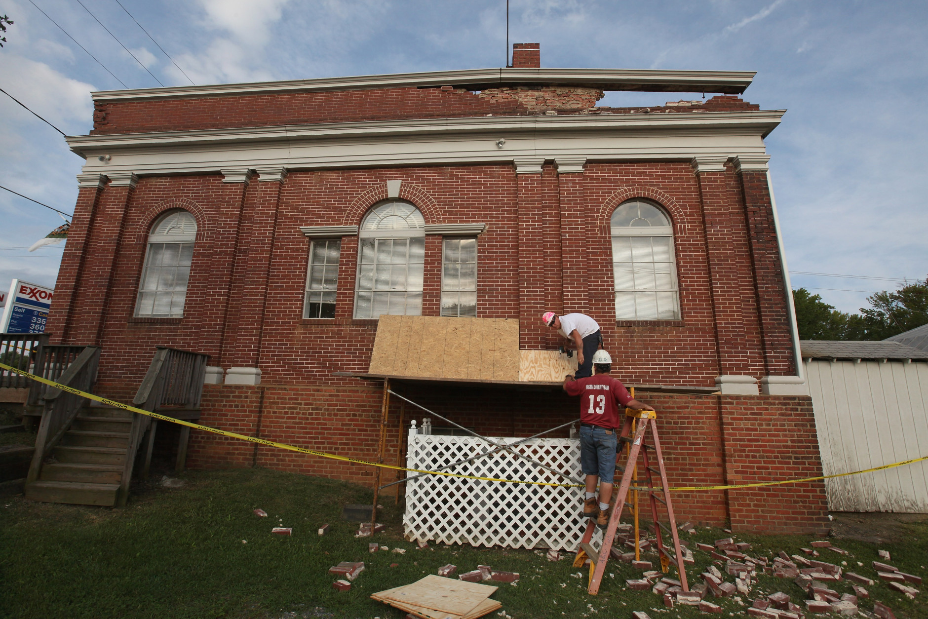 MINERAL, VA - AUGUST 24:  Workers begin repairs on the City Hall building, which is also the local DMV office, after the building was damged by yesterday's 5.8 earthquake August 24, 2011 in Mineral, Virginia. The epicenter of the quake, the East Coast's largest since 1944, was located a few miles outside of Mineral, a town of 430 people located about 50 miles west of Richmond.  (Photo by Scott Olson/Getty Images)