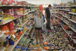 MINERAL, VA - AUGUST 24:  Morgan Nolan (C) joins other volunteers as they help to restock the shelves at Millers Market after the store was damaged by yesterday's 5.8 earthquake August 24, 2011 in Mineral, Virginia. The epicenter of the quake, the East Coast's largest since 1944, was located a few miles outside of Mineral, a town of 430 people located about 50 miles west of Richmond.  (Photo by Scott Olson/Getty Images)