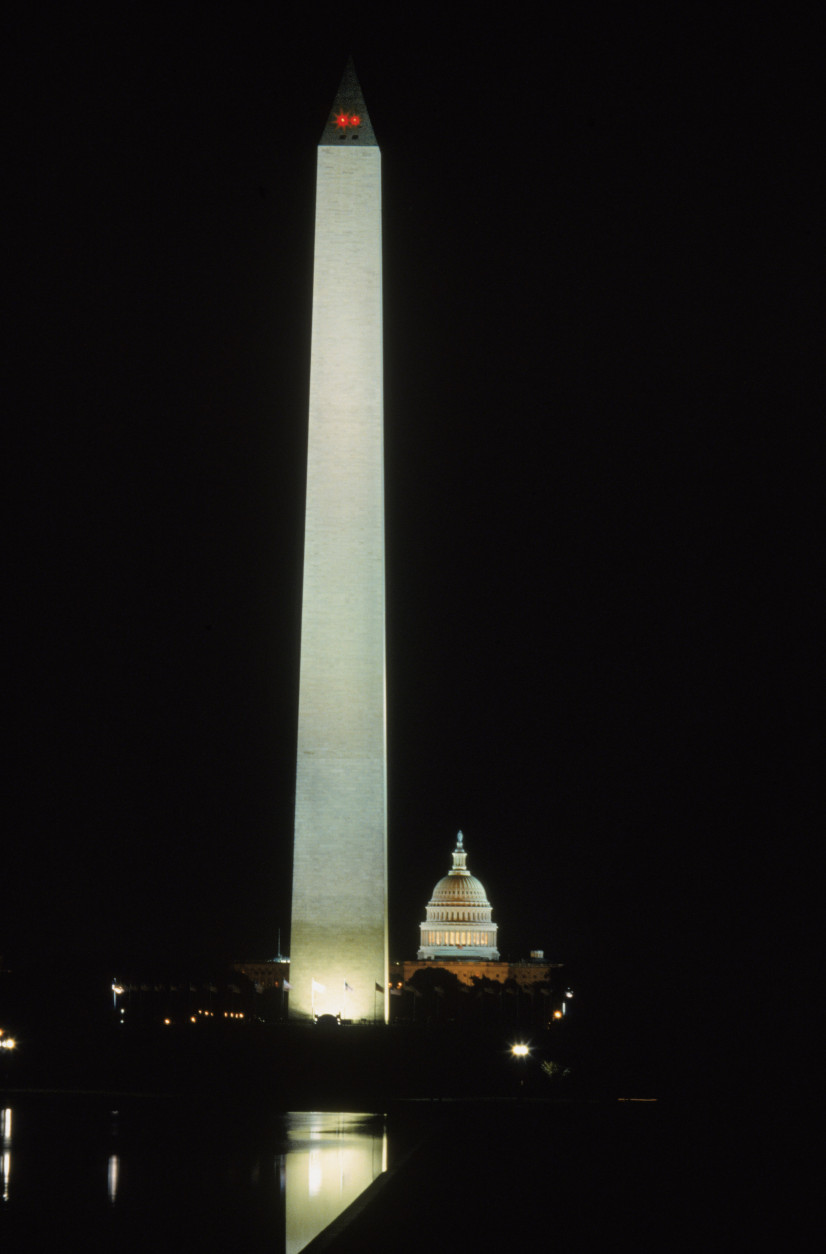 WASHINGTON - OCTOBER 01:  A general view of the Washington monument and the U.S. Capitol building illuminated at night in Wahington D.C. on October 01, 1992.  (Photo by Rick Stewart /Getty Images)