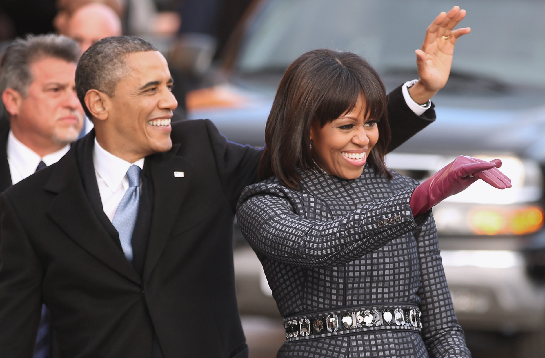 WASHINGTON, DC - JANUARY 21:  U.S. President Barack Obama and first lady Michelle Obama wave to supporters as they walk the inaugural parade route down Pennsylvania Avenue January 21, 2013 in Washington, DC. President Obama took the oath of office earlier in the day during a ceremony on the west front of the U.S. Capitol.  (Photo by Chip Somodevilla/Getty Images)