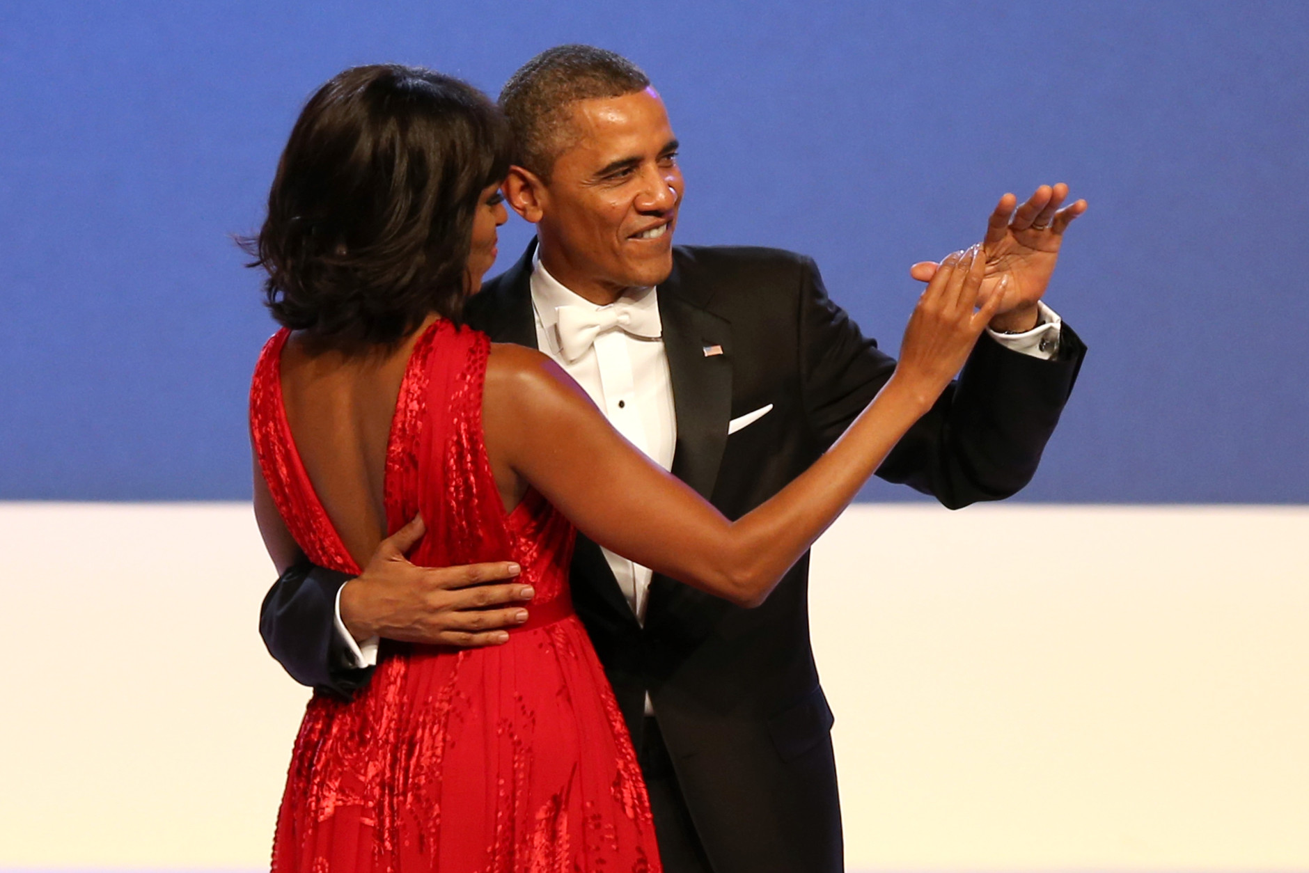 WASHINGTON, DC - JANUARY 21:  U.S. President Barack Obama and first lady Michelle Obama dance  during the Public Inaugural Ball at the Walter E. Washington Convention Center on January 21, 2013 in Washington, DC. President Obama was sworn in for his second term earlier in the day.  (Photo by Mario Tama/Getty Images)