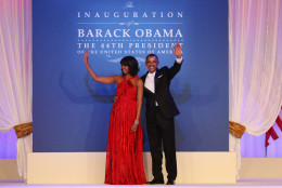 WASHINGTON, DC - JANUARY 21:  U.S. President Barack Obama and first lady Michelle Obama wave to the crowd during the Public Inaugural Ball at the Walter E. Washington Convention Center on January 21, 2013 in Washington, DC. President Obama was sworn in for his second term earlier in the day.  (Photo by Mario Tama/Getty Images)