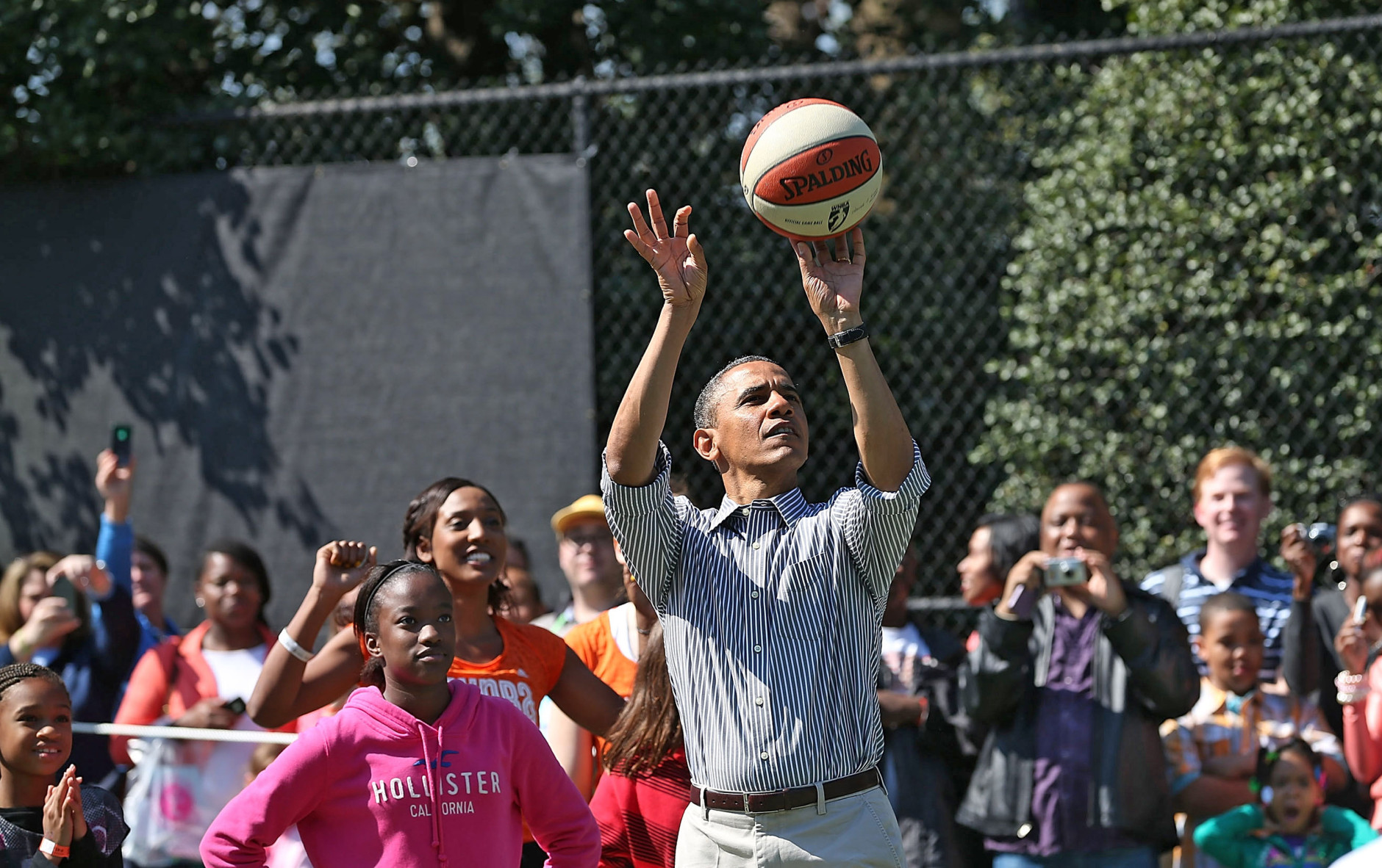 WASHINGTON, DC - APRIL 01:  U.S. President Barack Obama plays basketball with children during the annual Easter Egg Roll on the White House tennis court April 1, 2013 in Washington, DC. Thousands of people are expected to attend the 134-year-old tradition of rolling colored eggs down the White House lawn that was started by President Rutherford B. Hayes in 1878.  (Photo by Mark Wilson/Getty Images)
