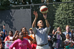 WASHINGTON, DC - APRIL 01:  U.S. President Barack Obama plays basketball with children during the annual Easter Egg Roll on the White House tennis court April 1, 2013 in Washington, DC. Thousands of people are expected to attend the 134-year-old tradition of rolling colored eggs down the White House lawn that was started by President Rutherford B. Hayes in 1878.  (Photo by Mark Wilson/Getty Images)