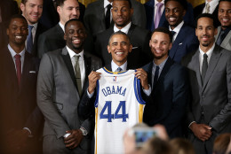 WASHINGTON, DC - FEBRUARY 04:  U.S. President Barack Obama holds a Golden State Warriors basketball jersey presented to him during an event with the team in the East Room on February 4, 2016 in Washington, DC. Obama welcomed the 2015 NBA Champion Golden State Warriors to the White House to congratulate the team on their championship season.  (Photo by Win McNamee/Getty Images)