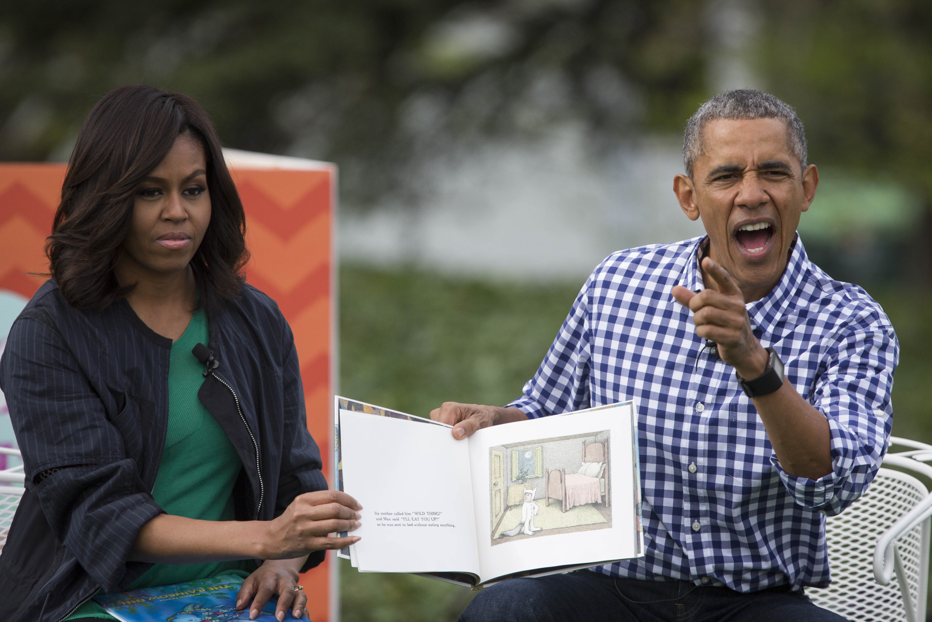 WASHINGTON, DC - MARCH 28: President Barack Obama and first lady Michelle Obama read from the book "Where the Wild Things Are" during the annual White House Easter Egg Roll on the South Lawn of the White House March 28, 2016 in Washington, DC. The tradition dates back to 1878 when President Rutherford B. Hayes allowed children to roll eggs on the South Lawn. (Photo by Drew Angerer/Getty Images)