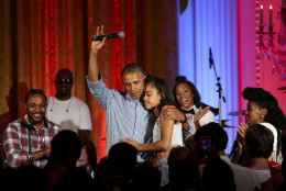 WASHINGTON, DC - JULY 4: President Barack Obama hugs his daughter Malia Obama at the Fourth of July White House party on July 4, 2016 in Washington, DC. Maila Obama celebrated her 18th birthday during the party, which featured guests including singers Janelle Monae and Kendrick Lamar. (Photo by Aude Guerrucci-Pool/Getty Images)
