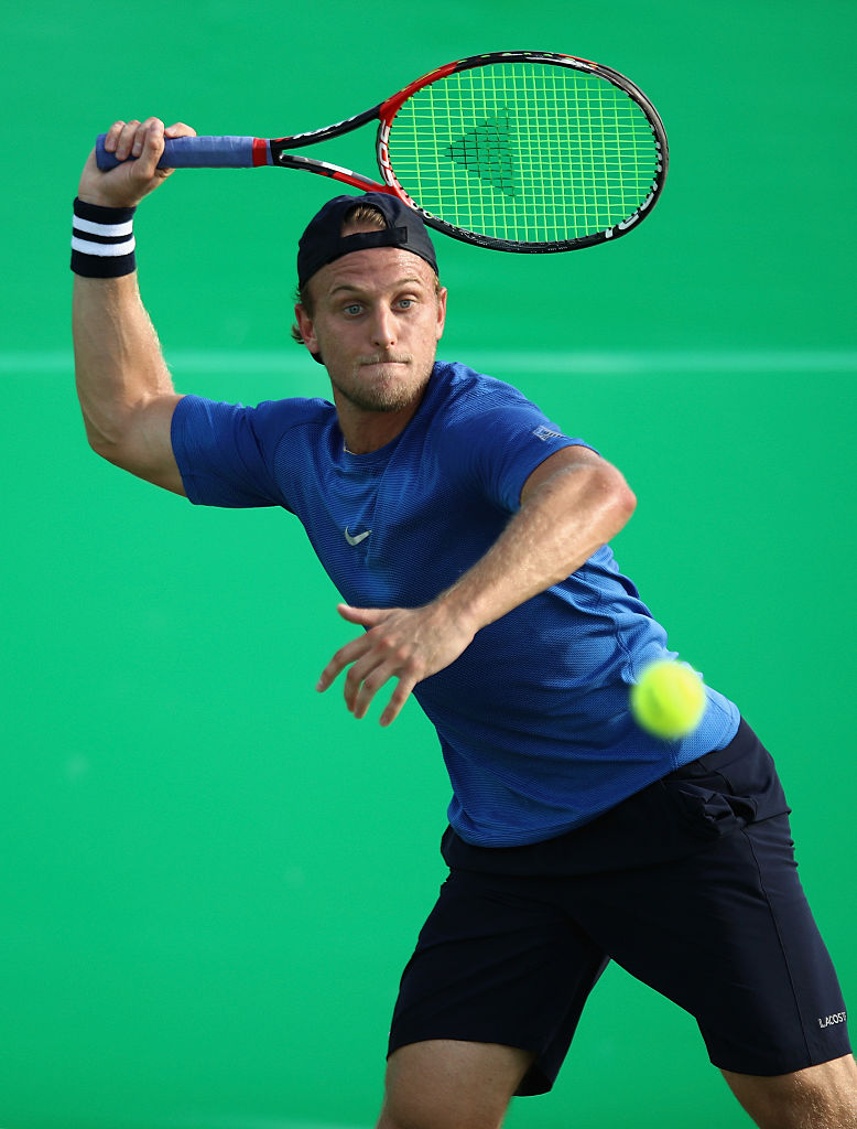 RIO DE JANEIRO, BRAZIL - AUGUST 06:  Denis Kudla of USA in action against Andrej Martin of Slovakia in the men's first round on Day 1 of the Rio 2016 Olympic Games at the Olympic Tennis Centre on August 6, 2016 in Rio de Janeiro, Brazil.  (Photo by Julian Finney/Getty Images)