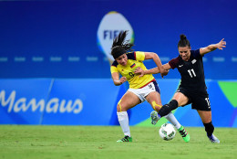 MANAUS, AMAZONAS - AUGUST 09:  Orianica Velasquez #9 of Colombia and Ali Krieger #11 of the United States vie for the ball in the second half of the Women's Football First Round Group G match on Day 4 of the Rio 2016 Olympic Games at Amazonia Arena on August 9, 2016 in Rio de Janeiro, Brazil.  (Photo by Bruno Zanardo/Getty Images)