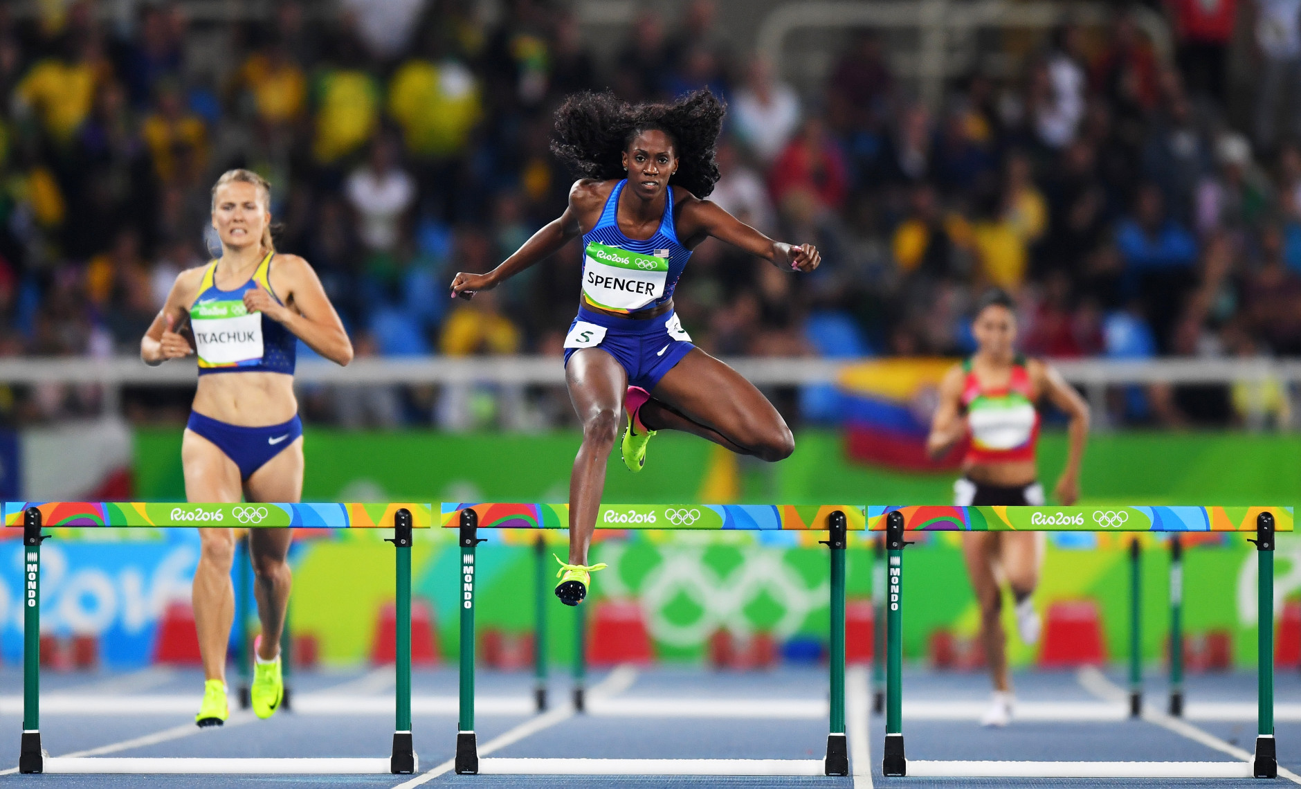 RIO DE JANEIRO, BRAZIL - AUGUST 15:  Ashley Spencer of the United States (C) competes in the Women's 400m Hurdles Round 1 - Heat 3 on Day 10 of the Rio 2016 Olympic Games at the Olympic Stadium on August 15, 2016 in Rio de Janeiro, Brazil.  (Photo by Quinn Rooney/Getty Images)