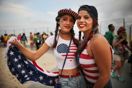 RIO DE JANEIRO, BRAZIL - AUGUST 15:  United States fans pose after their men's beach volleyball team lost to Brazil during the Rio 2016 Olympic Games on August 15, 2016 in Rio de Janeiro, Brazil. Host country Brazil advances to the semifinal in the event being held on Copacabana beach.  (Photo by Mario Tama/Getty Images)
