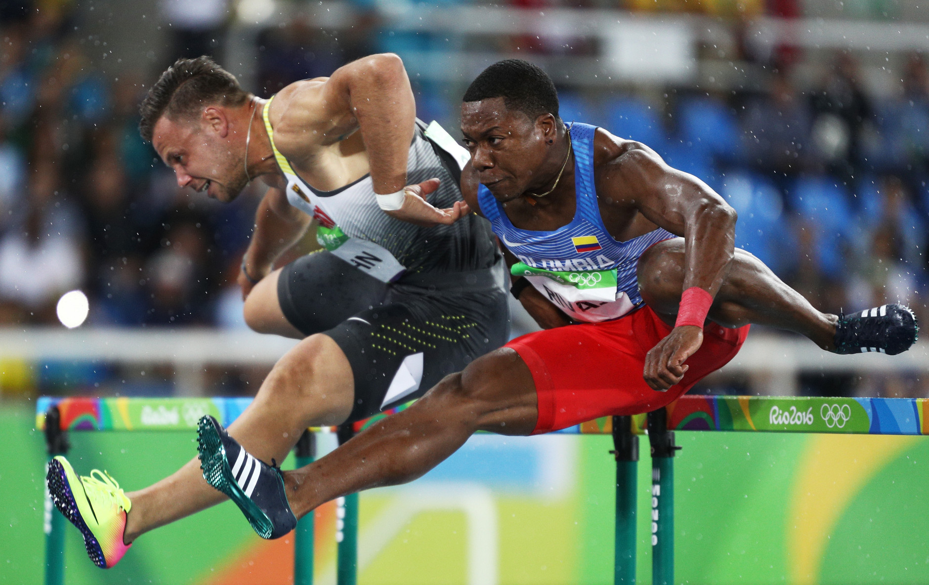 RIO DE JANEIRO, BRAZIL - AUGUST 15:  Alexander John of Germany (L) and Yeison Rivas of Colombia compete during the Men's 110m Hurdles Round 1 - Heat 1 on Day 10 of the Rio 2016 Olympic Games at the Olympic Stadium on August 15, 2016 in Rio de Janeiro, Brazil.  (Photo by Paul Gilham/Getty Images)