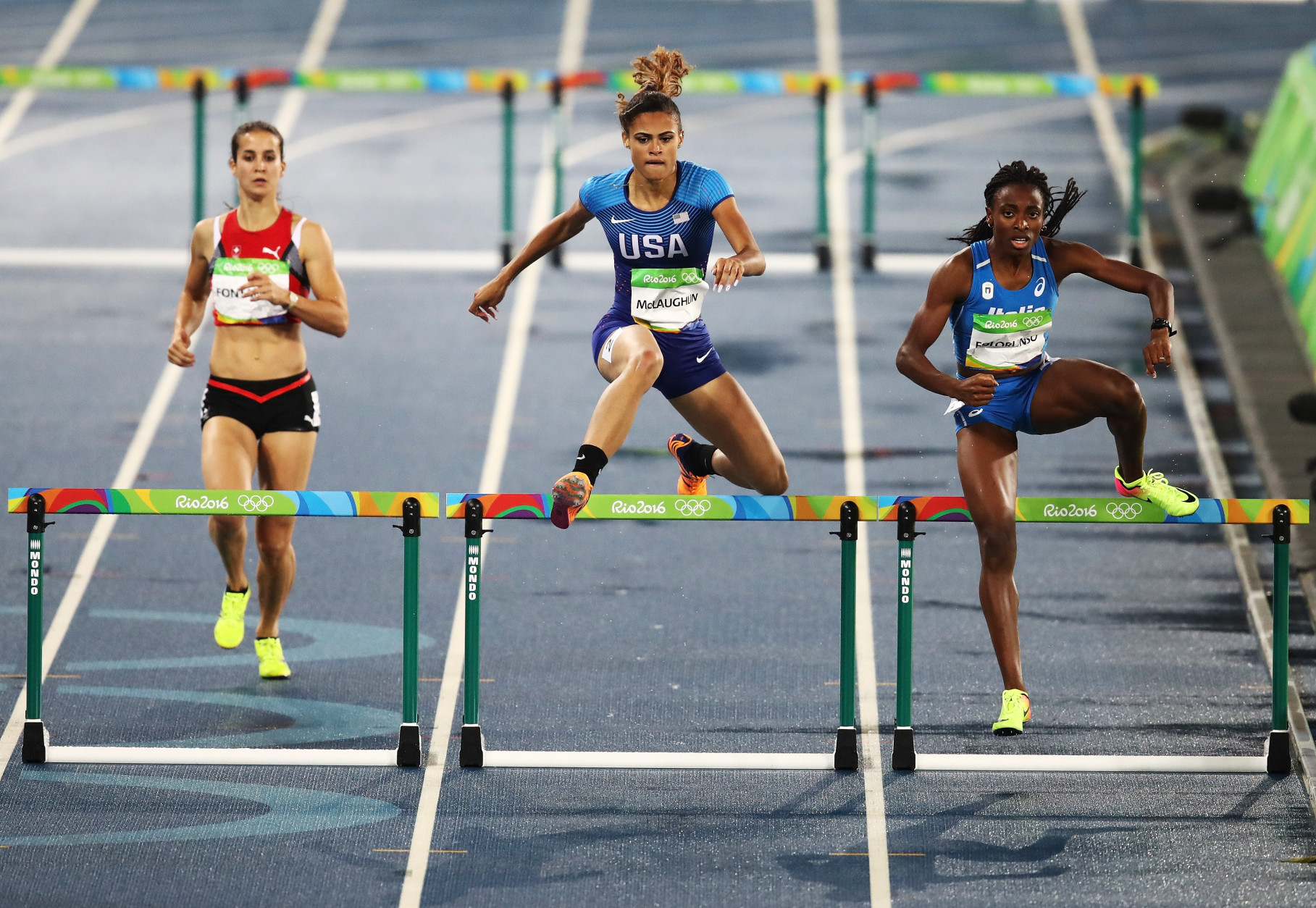 RIO DE JANEIRO, BRAZIL - AUGUST 15:  Sydney McLaughlin of the United States (C) competes during the Women's 400m Hurdles Round 1 - Heat 1 on Day 10 of the Rio 2016 Olympic Games at the Olympic Stadium on August 15, 2016 in Rio de Janeiro, Brazil.  (Photo by Cameron Spencer/Getty Images)