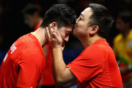 RIO DE JANEIRO, BRAZIL - AUGUST 17:  Long Ma of China celebrates with head coach Liu Guoliang after the Men's Table Tennis gold medal match against Maharu Yoshimura of Japan at Riocentro - Pavilion 3 on Day 12 of the Rio 2016 Olympic Games  on August 17, 2016 in Rio de Janeiro, Brazil.  (Photo by Phil Walter/Getty Images)