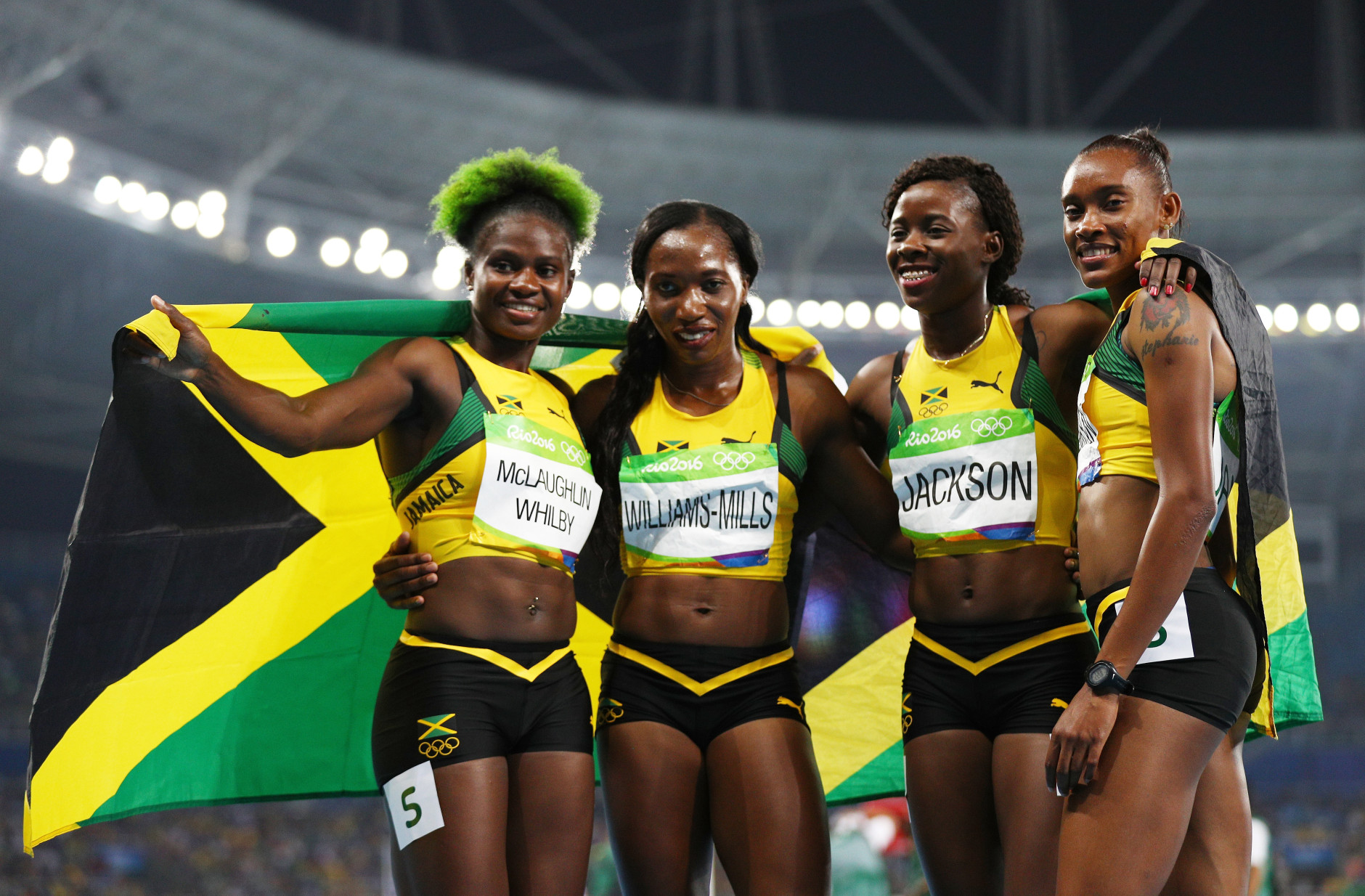 RIO DE JANEIRO, BRAZIL - AUGUST 20:  (L-R) Anneisha McLaughlin-Whilby, Novlene Williams-Mills, Shericka Jackson and Stephenie Ann Mcpherson of Jamaica react after winning silver in the Women's 4 x 400 meter Relay on Day 15 of the Rio 2016 Olympic Games at the Olympic Stadium on August 20, 2016 in Rio de Janeiro, Brazil.  (Photo by Ian Walton/Getty Images)