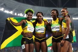 RIO DE JANEIRO, BRAZIL - AUGUST 20:  (L-R) Anneisha McLaughlin-Whilby, Novlene Williams-Mills, Shericka Jackson and Stephenie Ann Mcpherson of Jamaica react after winning silver in the Women's 4 x 400 meter Relay on Day 15 of the Rio 2016 Olympic Games at the Olympic Stadium on August 20, 2016 in Rio de Janeiro, Brazil.  (Photo by Ian Walton/Getty Images)