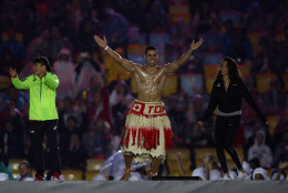 RIO DE JANEIRO, BRAZIL - AUGUST 21:  Pita Taufatofua of Tonga jumps on stage during the Closing Ceremony on Day 16 of the Rio 2016 Olympic Games at Maracana Stadium on August 21, 2016 in Rio de Janeiro, Brazil.  (Photo by Ezra Shaw/Getty Images)