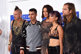 NEW YORK, NY - AUGUST 28:  (L-R) Cole Whittle, Joe Jonas, JinJoo Lee, Jack Lawless of DNCE with Ashley Graham (C) attend the 2016 MTV Video Music Awards at Madison Square Garden on August 28, 2016 in New York City.  (Photo by Jamie McCarthy/Getty Images)
