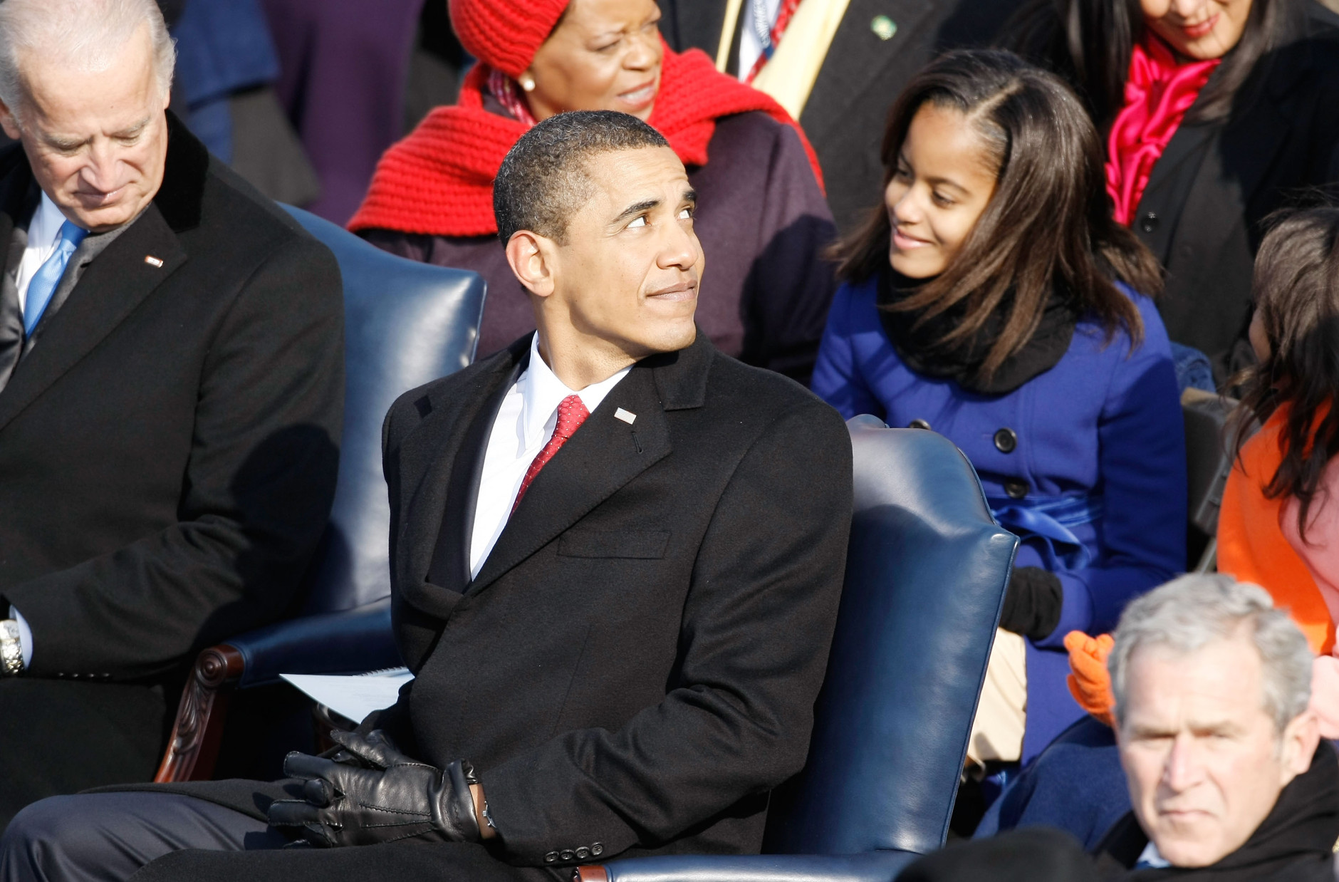 WASHINGTON - JANUARY 20:  President-elect Barack Obama looks back during his inauguration as his daughter Malia looks on  January 20, 2009 in Washington, DC. Obama becomes the first African-American to be elected to the office of President in the history of the United States.  (Photo by Chip Somodevilla/Getty Images)