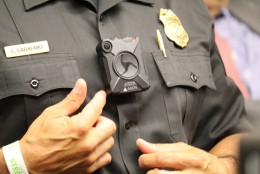 Moco Police Lt Chuck Carafano indicates his body camera. (WTOP/Kate Ryan)