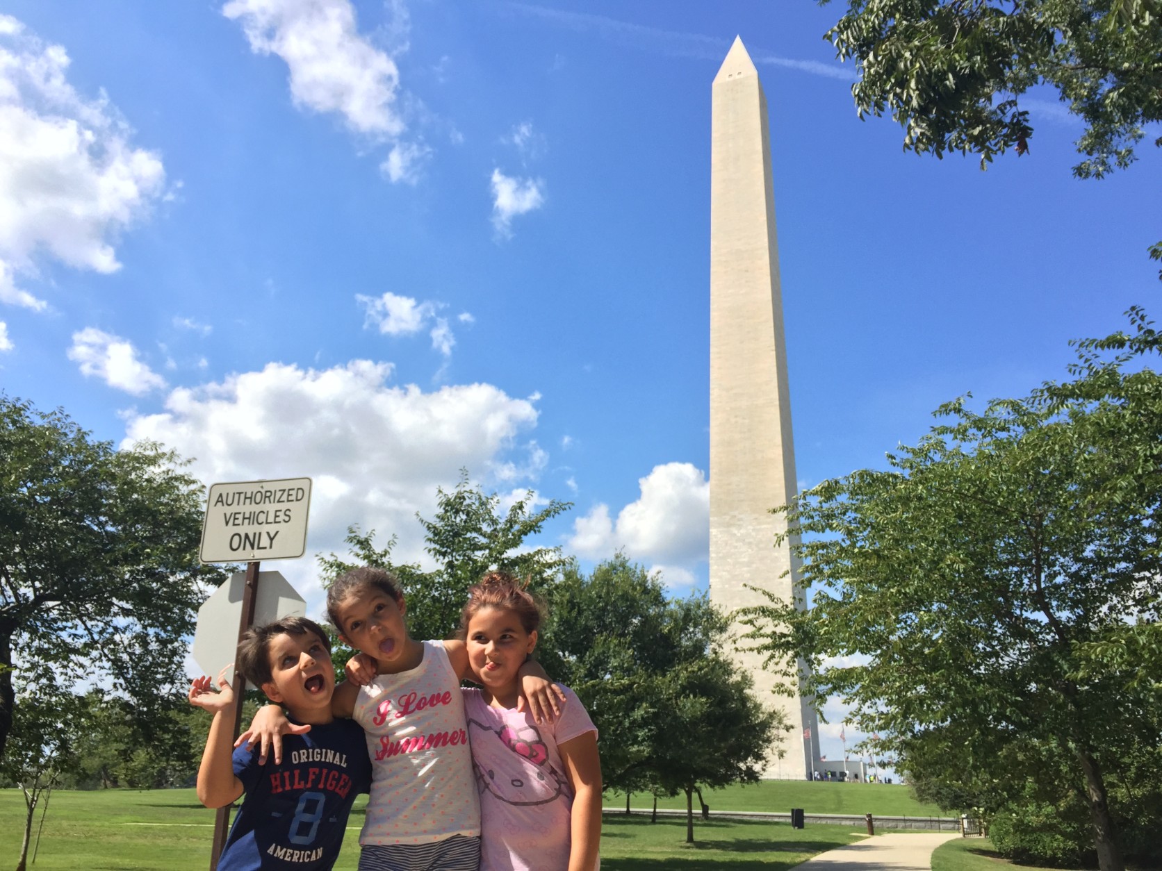 The Leone children of Dale City in front of the Washington Monument Wednesday, Aug. 24, 2016 -- the same day the National Park Service announced elevator problems would close the monument until September with another eight- or nine-month closure on the horizon. (WTOP/Kristi King)