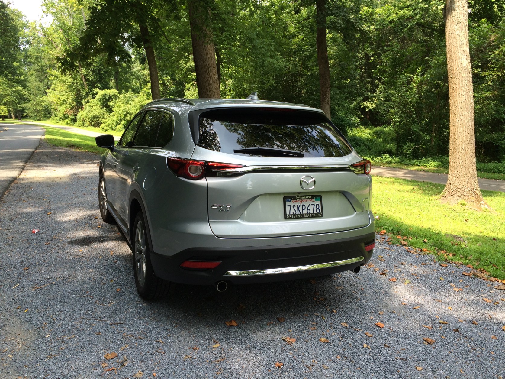 The rear of the Mazda CX-9 departs from the usual boring look with dual exhaust pipes and the different trim colors, and the bumper has some tasteful chrome accents. (WTOP/Mike Parris)