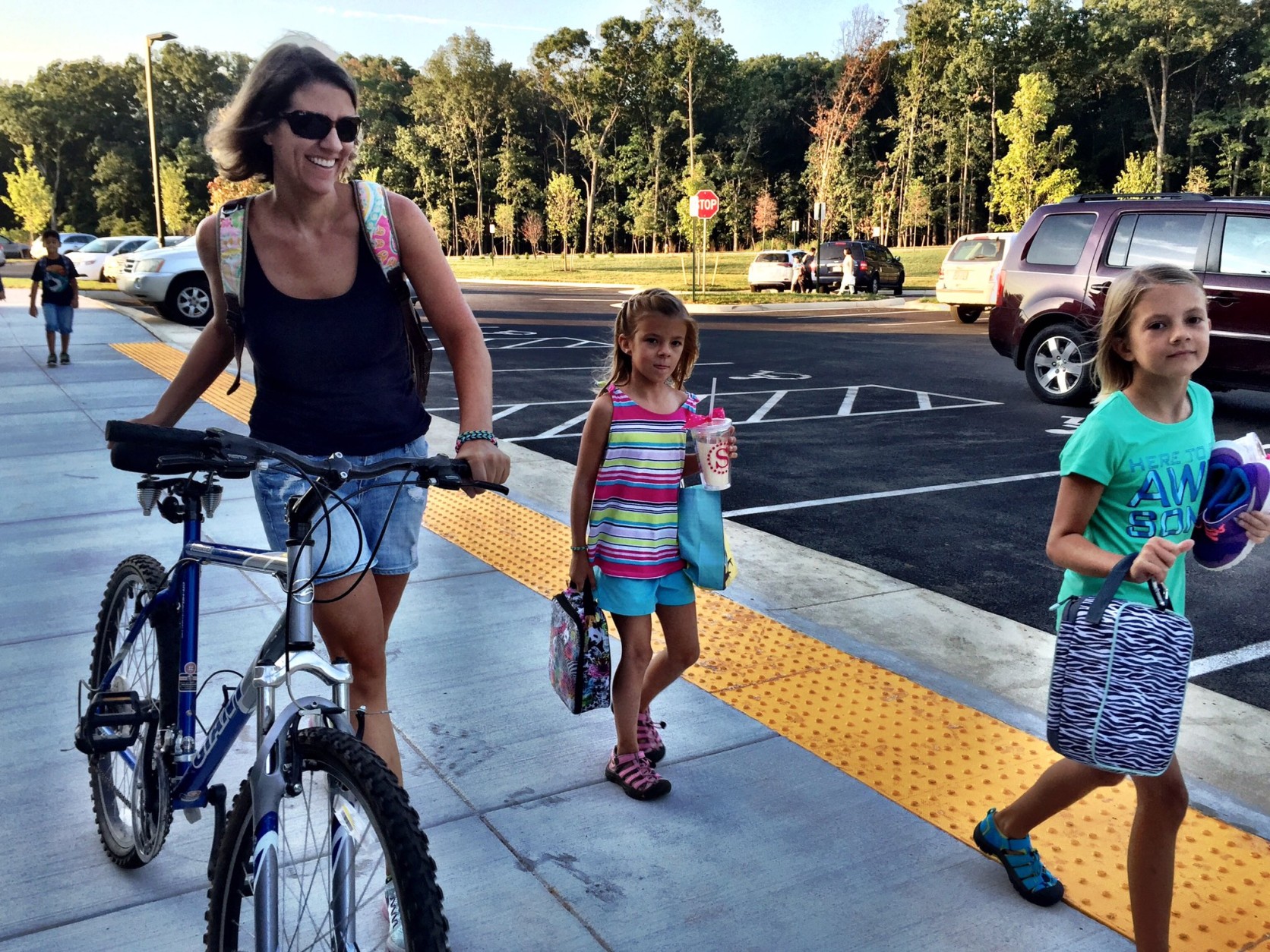 The McMahon family arrives for the first day of school at Madison's Trust Elementary, in Loudoun County. Students in Loudoun County returned to class before Labor Day, after getting a waiver from the state.  (WTOP/Neal Augenstein)