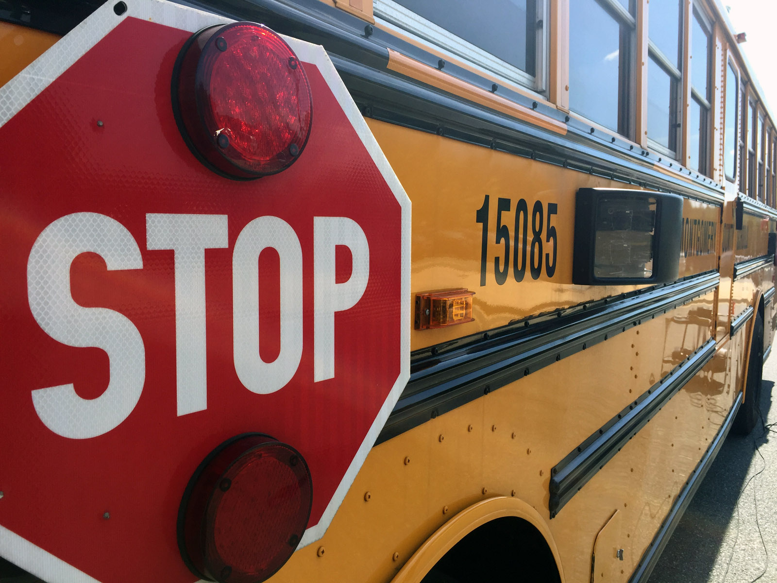School bus stop-arm cameras will be installed on all of Montgomery County's public schools buses in the next three years. Another 100 should come online this fall along with a package of other technology upgrades include GPS locators and voice of internet communication for bus drivers. (WTOP/Kristi King)