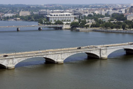 An aerial view of the Kennedy Center for the Performing Arts, center back,  Key Bridge, center, and Memorial Bridge, forground, and the Potomac River in Washington, Friday, July 29, 2011. (AP Photo/Cliff Owen)