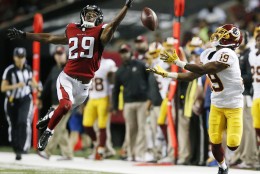 Atlanta Falcons cornerback C.J. Goodwin (29) breaks up a pass intended for Washington Redskins wide receiver Rashad Ross (19) during the first half of a preseason NFL football game, Thursday, Aug. 11, 2016, in Atlanta. (AP Photo/Brynn Anderson)