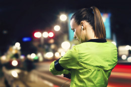 Young woman jogging at night in the city