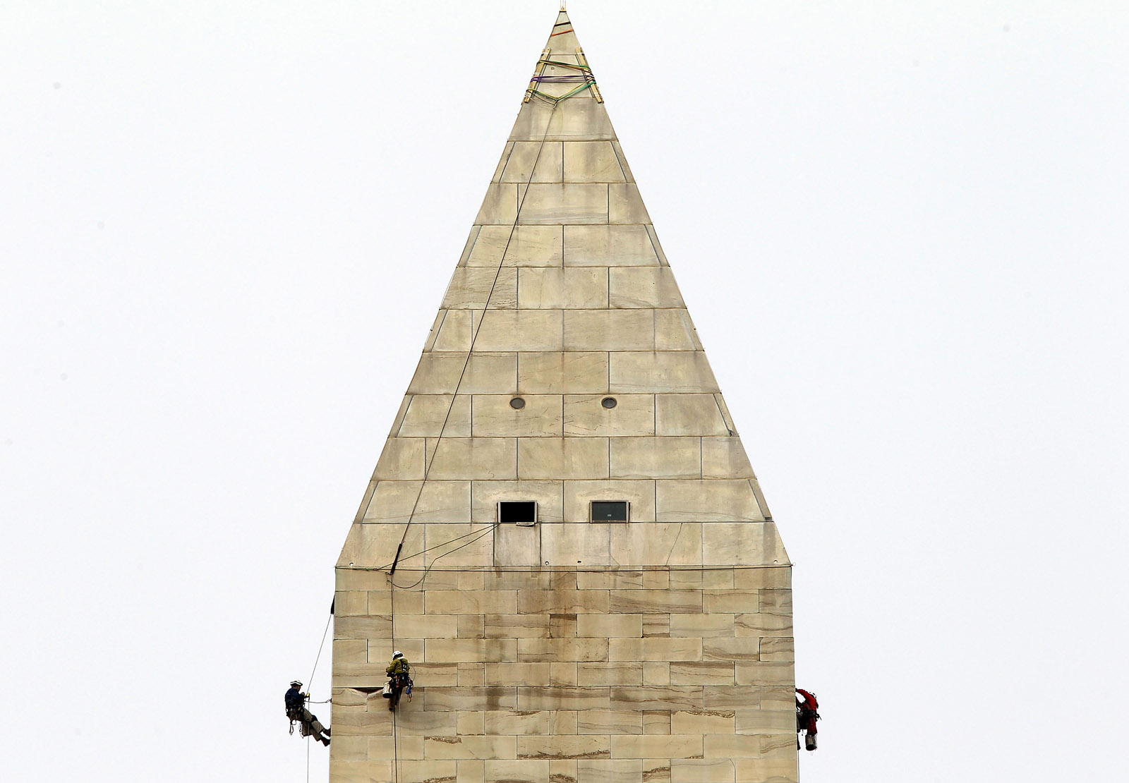 WASHINGTON, DC - OCTOBER 03:  Difficult Access Team (DAT) engineers with Wiss, Janney, Elstner Associates examine stones of the Washington Monument for cracks October 3, 2011 in Washington, DC. The DAT team continued the inspection of the monument to check for more damage caused by the 5.8-magnitude earthquake on August 23, 2011.  (Photo by Alex Wong/Getty Images)