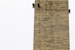 WASHINGTON, DC - OCTOBER 03:  Difficult Access Team (DAT) engineers with Wiss, Janney, Elstner Associates examine stones of the Washington Monument for cracks October 3, 2011 in Washington, DC. The DAT team continued the inspection of the monument to check for more damage caused by the 5.8-magnitude earthquake on August 23, 2011.  (Photo by Alex Wong/Getty Images)